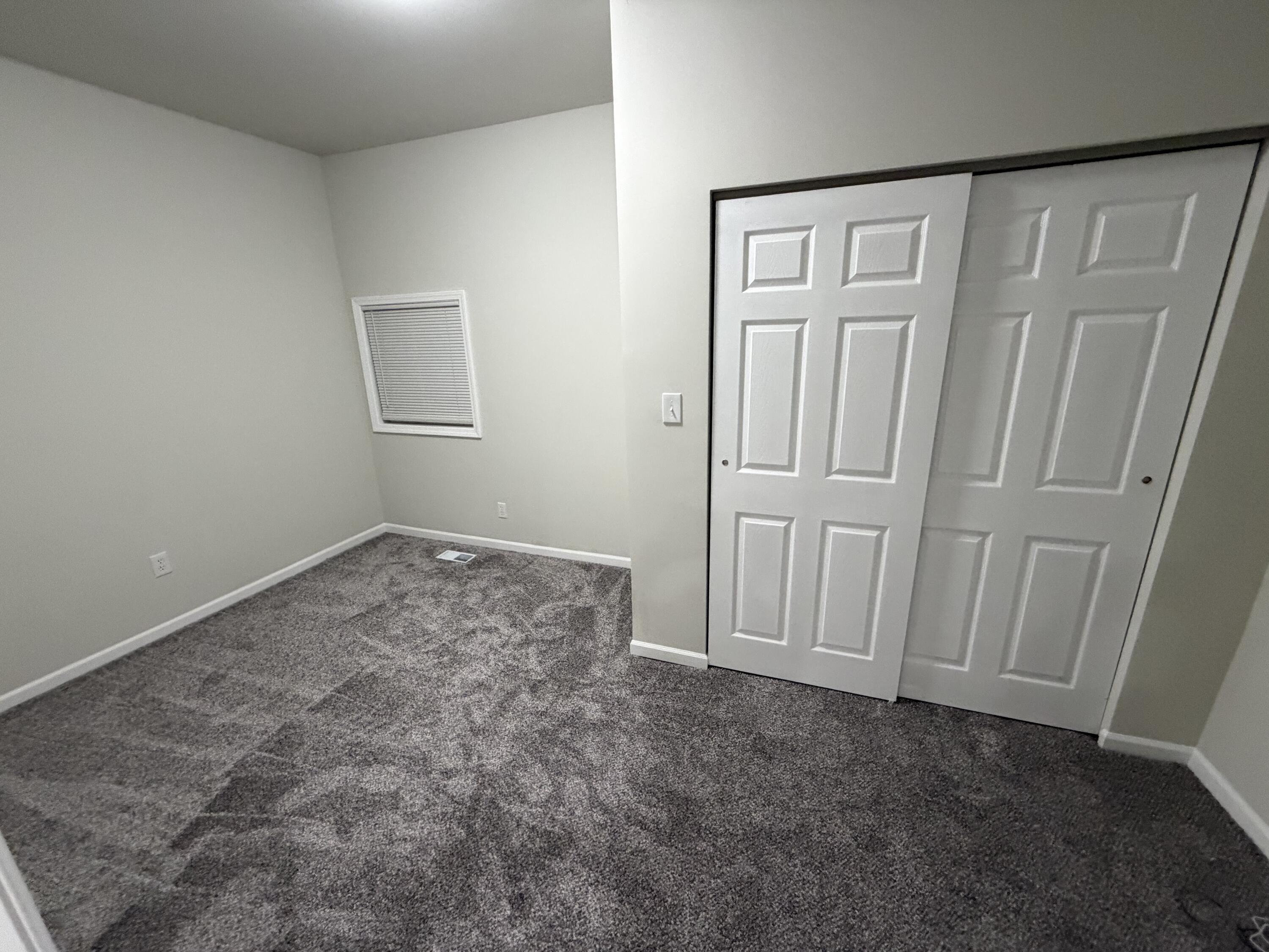 3744 Washington Street Gary, IN 46408 - Photo 10 of 25 an empty room with a wooden door