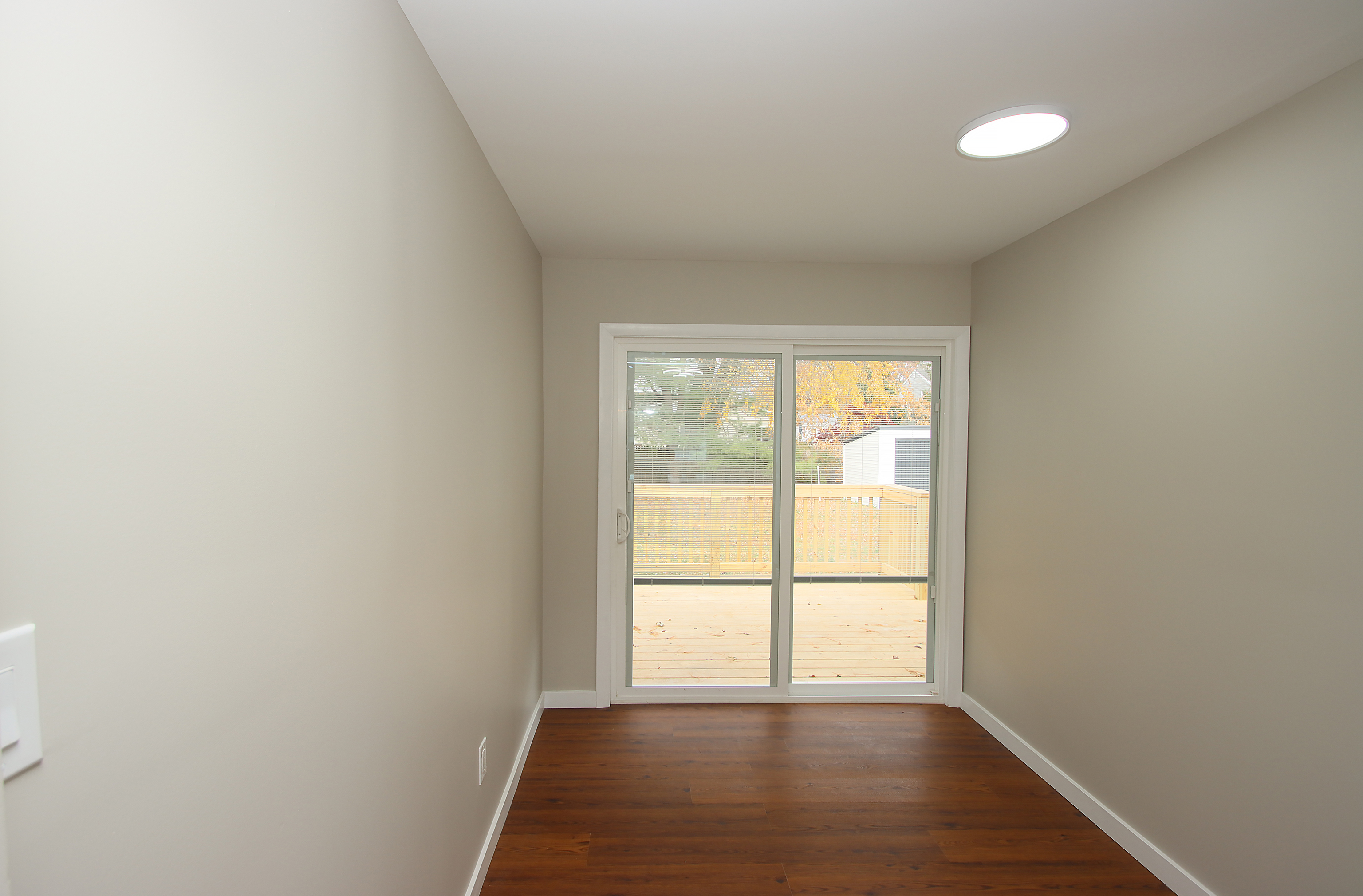 18 Riverdale Road Milford, CT 06460 - Photo 16 of 33 Large hallway going to the slider to the deck and the back yard.
