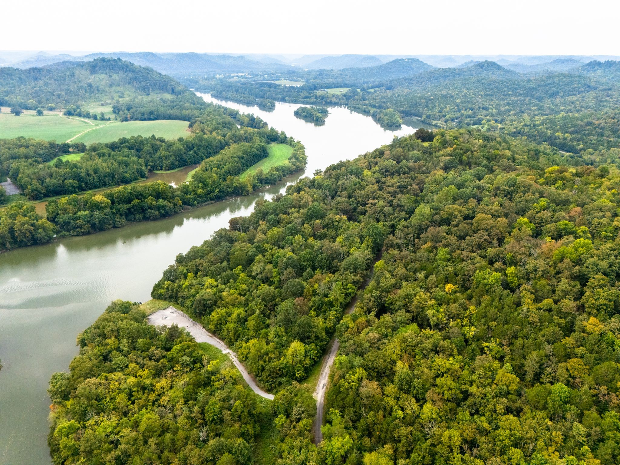 0 Big Branch Road Granville, TN 38564 - Photo 4 of 15 a view of a lush green field with a lake view