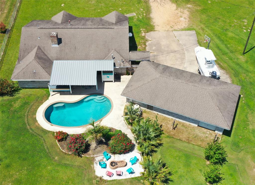 2301 South Byrd Avenue Shepherd, TX 77371 - Photo 1 of 49 an aerial view of a house with a yard and lake view