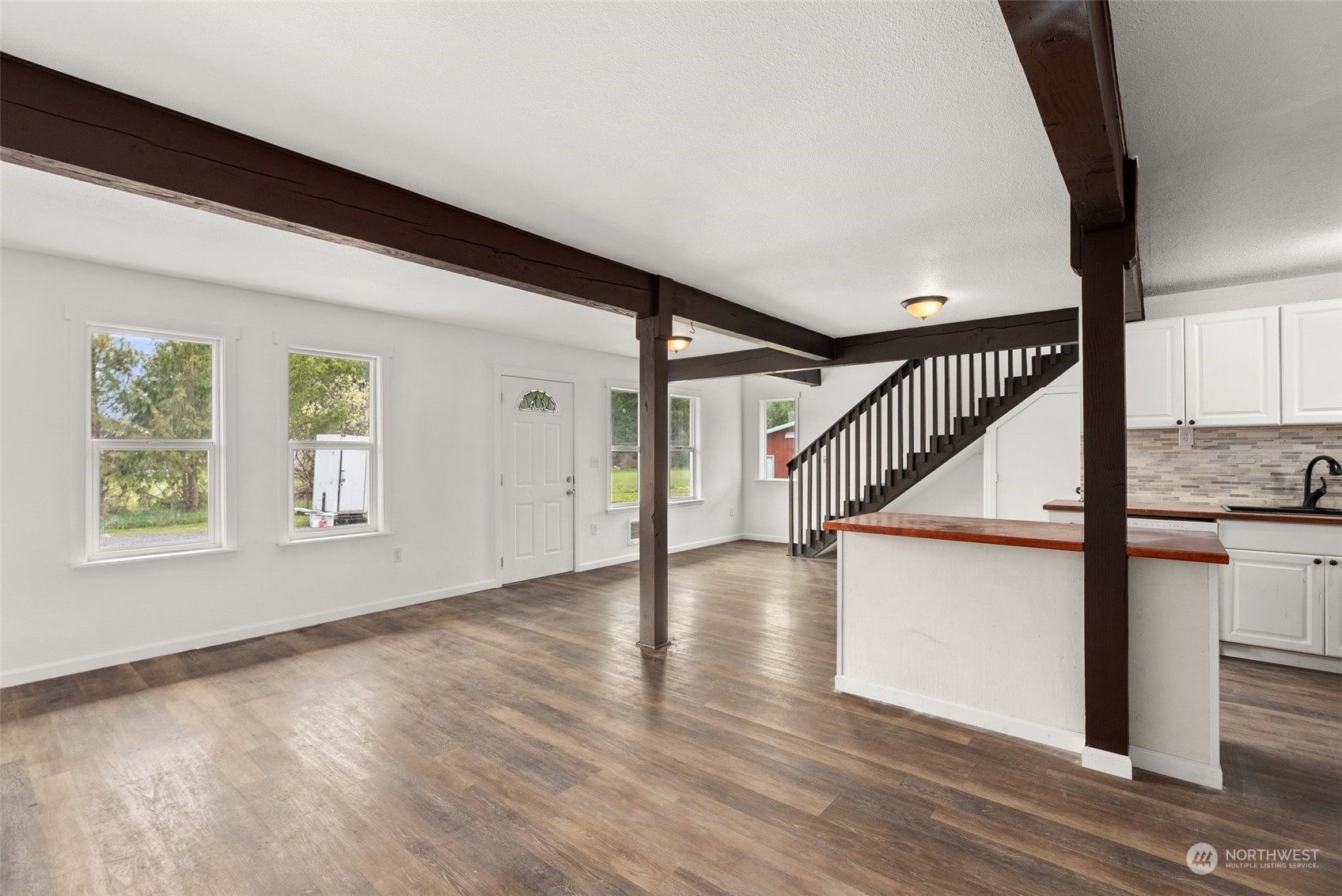 127 Remy Lane Chehalis, WA 98532 - Photo 11 of 24 a view of an entryway with wooden floor and windows