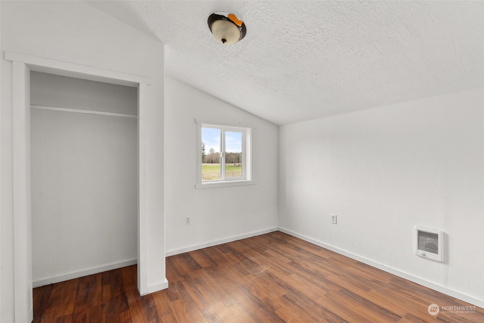 127 Remy Lane Chehalis, WA 98532 - Photo 16 of 24 a view of a room with wooden floor and fan