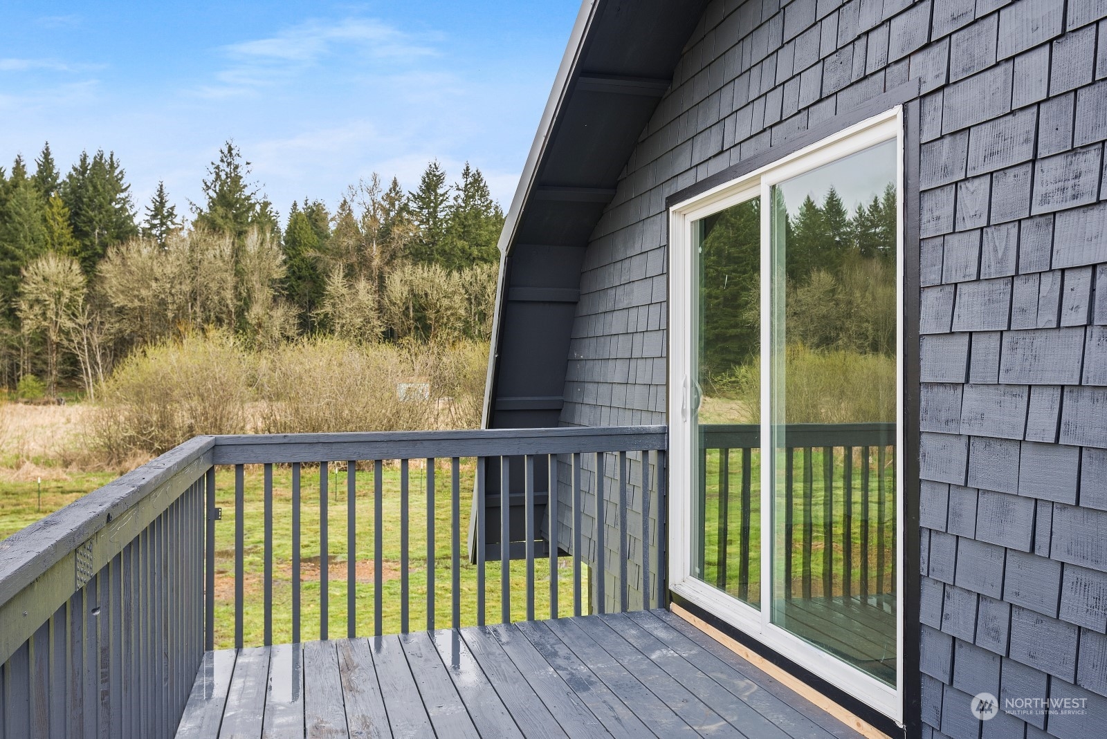 127 Remy Lane Chehalis, WA 98532 - Photo 20 of 24 a view of a balcony with a floor to ceiling window and wooden fence