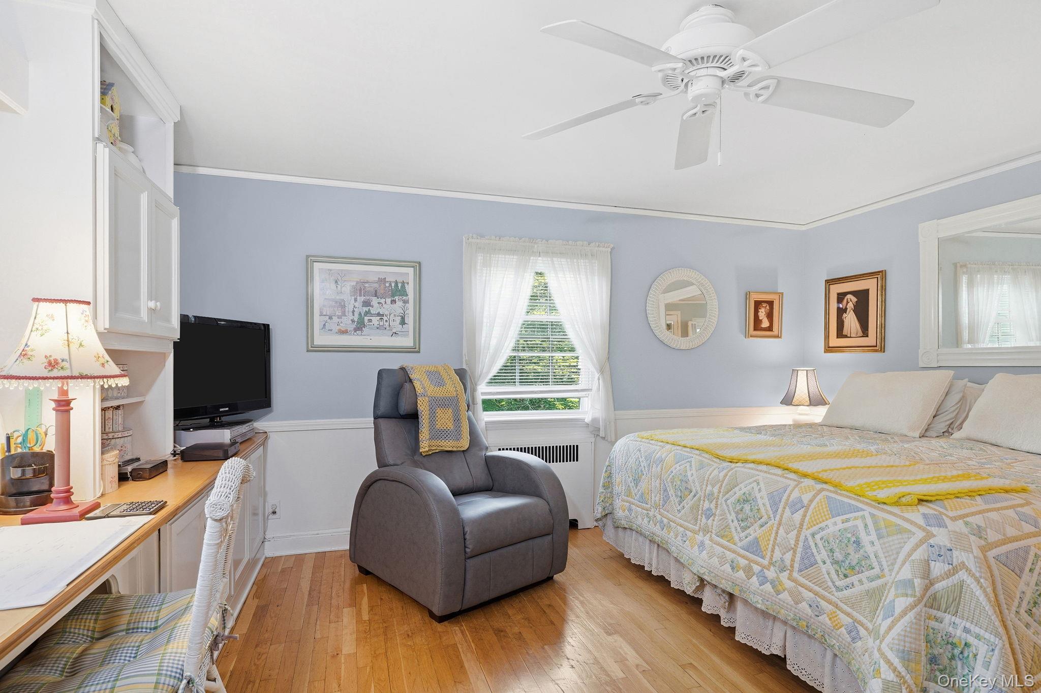 26 Cedarlawn Road Irvington, NY 10533 - Photo 18 of 34 a bedroom with a bed window and a flat screen tv