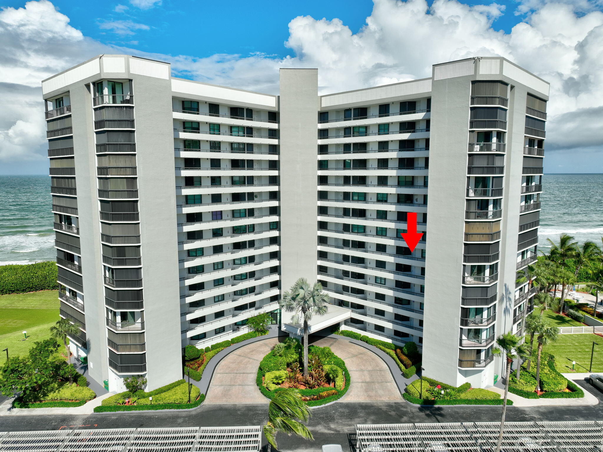 a front view of a building with garden