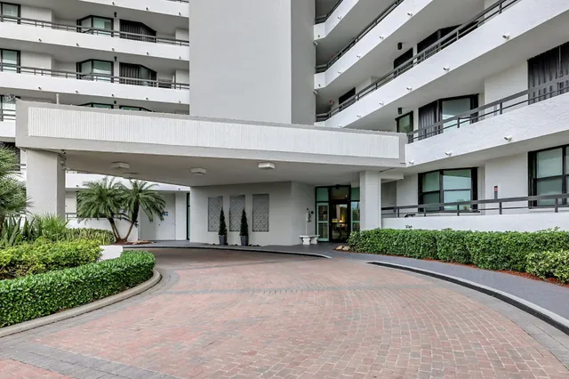 a view of a building with a yard