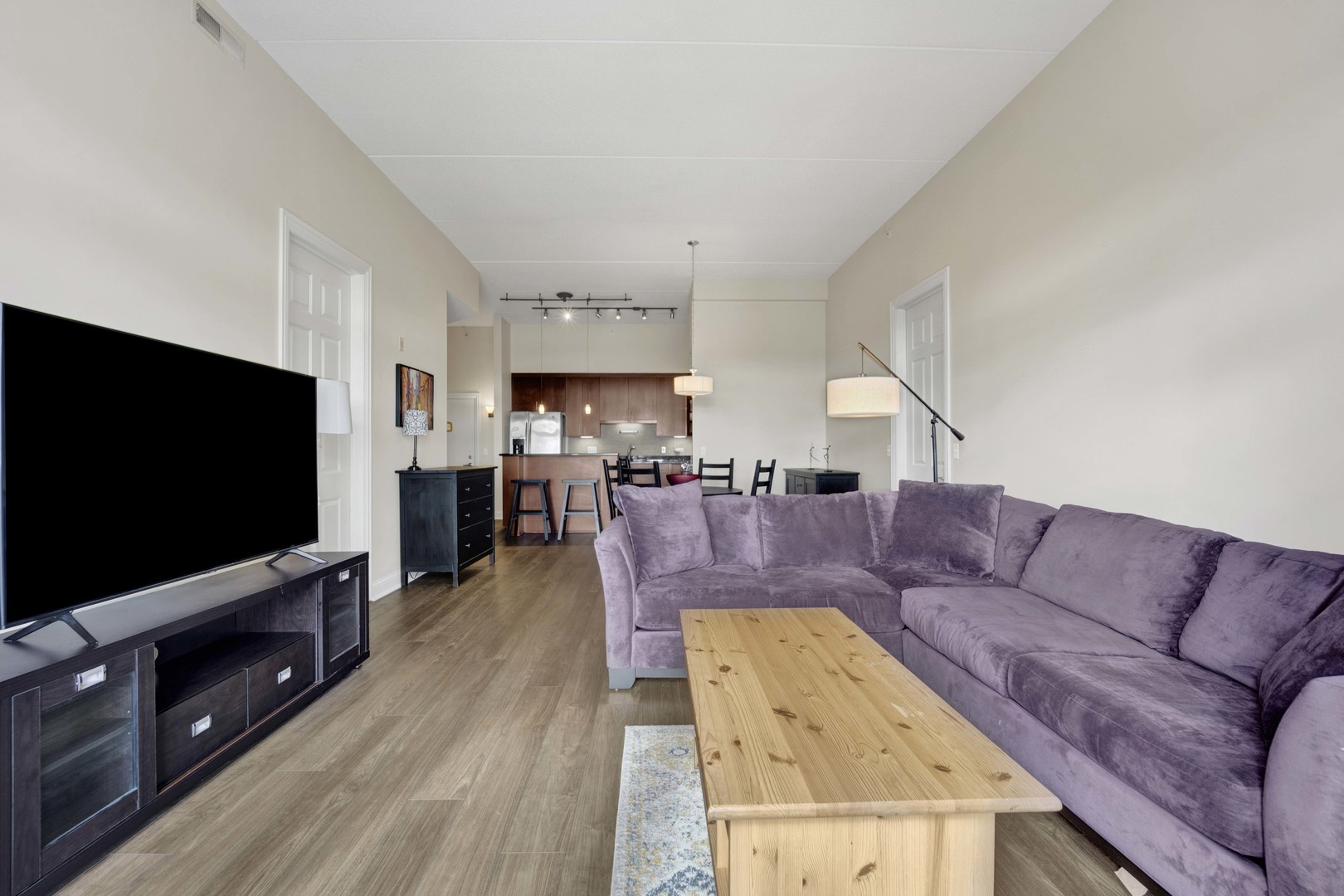 799 Graceland Avenue, Unit 504A Des Plaines, IL 60016 - Photo 13 of 25 a living room with furniture and a flat screen tv