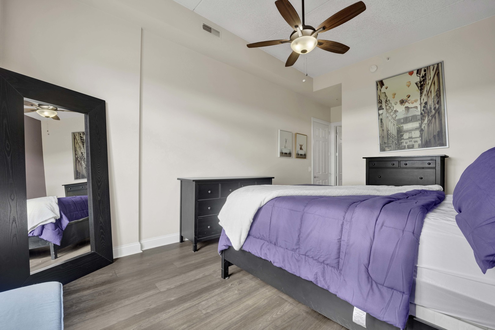 799 Graceland Avenue, Unit 504A Des Plaines, IL 60016 - Photo 18 of 25 a bedroom with a bed and a chandelier