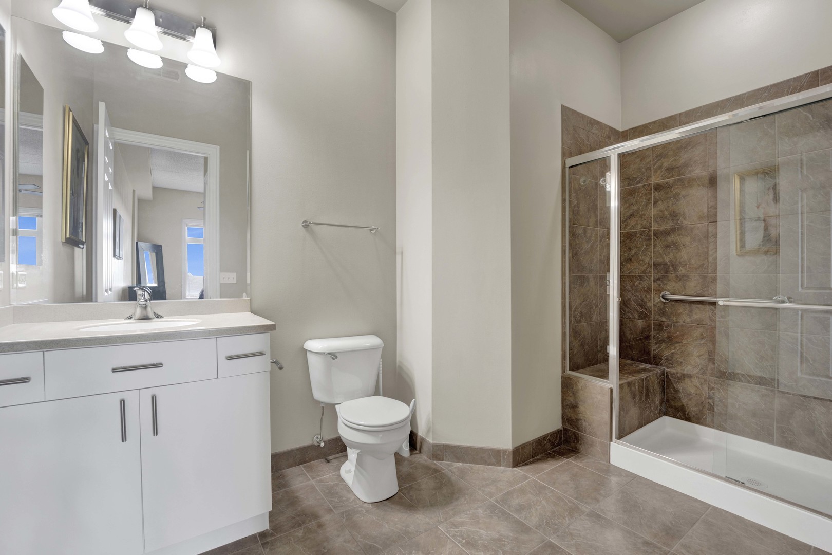 799 Graceland Avenue, Unit 504A Des Plaines, IL 60016 - Photo 21 of 25 a bathroom with a toilet sink and shower