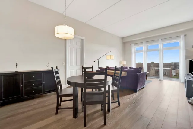 a view of a dining room with furniture and wooden floor