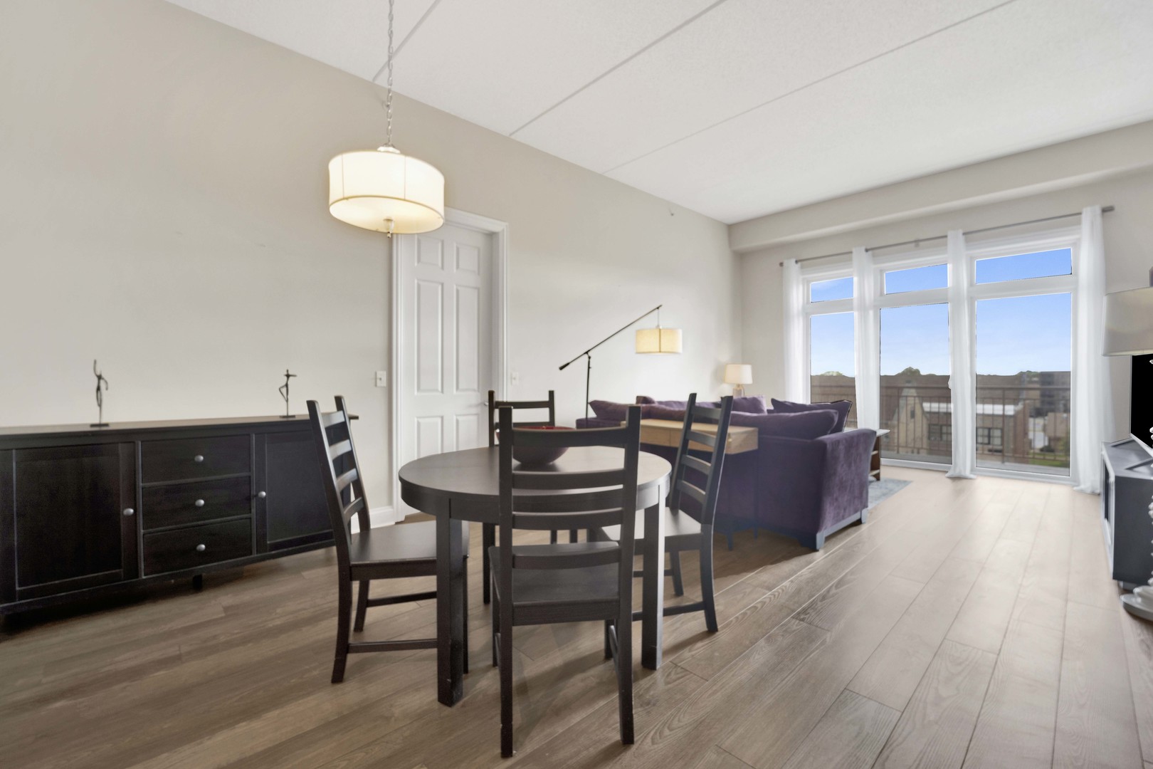 799 Graceland Avenue, Unit 504A Des Plaines, IL 60016 - Photo 9 of 25 a view of a dining room with furniture and wooden floor