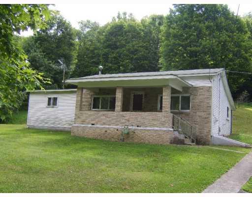 Exterior Front. 3 bedroom ranch on 4 acres!