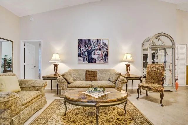 a view of a kitchen with kitchen island and stainless steel appliances