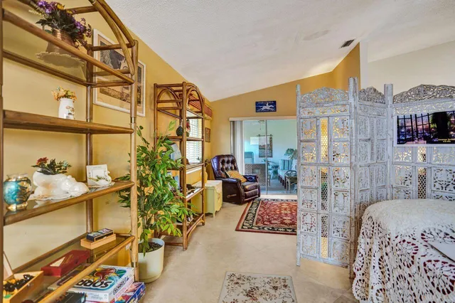 a bedroom with a bed and dresser