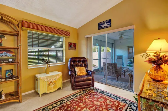 a bathroom with a sink vanity granite toilet and a shower