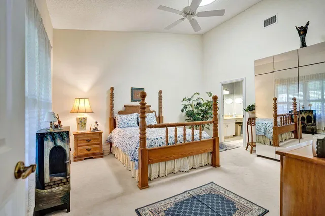 a bathroom with a shower a toilet and a sink