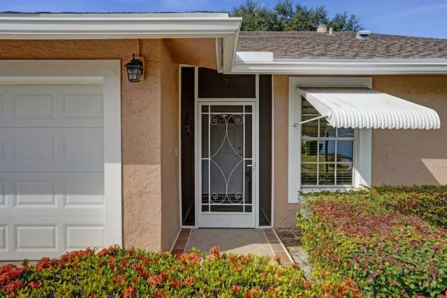 a view of a hallway view with living room and dining room view