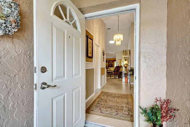a living room with furniture and a lamp
