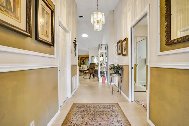 a living room with furniture kitchen and a table