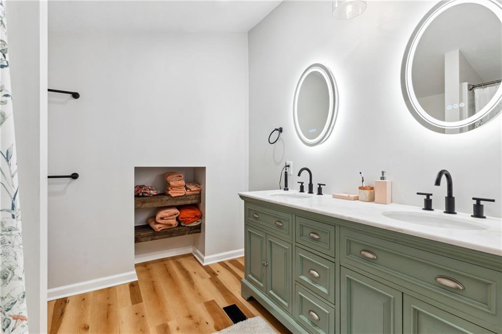 205 Rennick Road Butler, PA 16002 - Photo 26 of 40 a bathroom with a granite countertop double vanity sink and a mirror