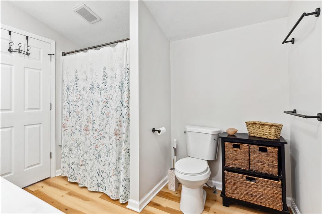205 Rennick Road Butler, PA 16002 - Photo 28 of 40 a bathroom with a toilet and a shower curtain
