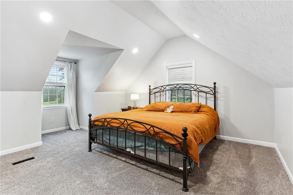 205 Rennick Road Butler, PA 16002 - Photo 31 of 40 a bed sitting in a bedroom next to a window