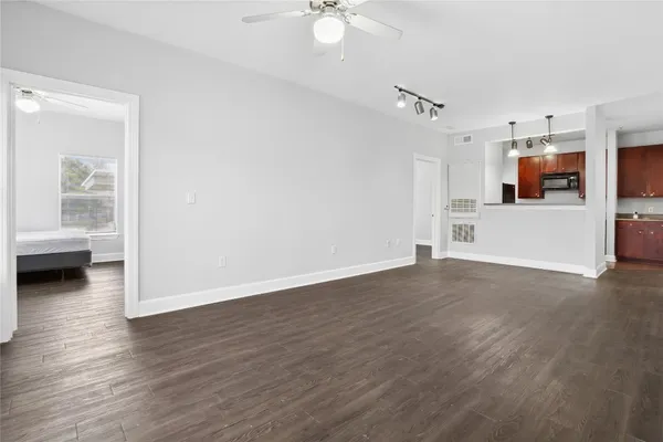 a utility room with cabinets washer and dryer