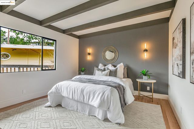 a bedroom with a bed and window