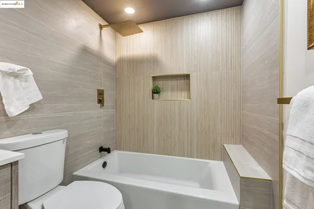 a bathroom with a toilet and a bathtub