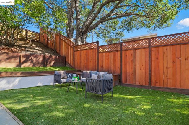 a view of a backyard with a small cabin