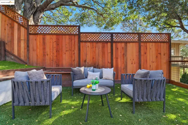 a view of a backyard with furniture