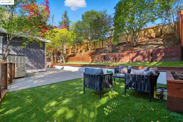 a view of yard with patio