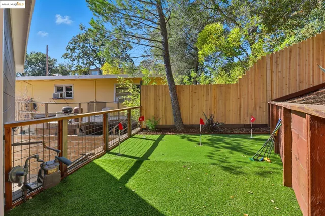 a view of a backyard with of a house
