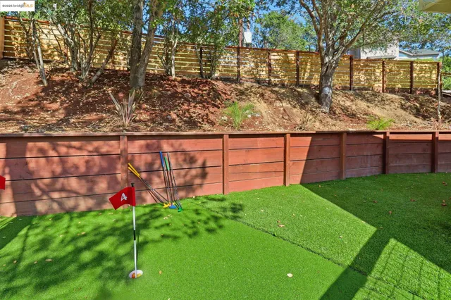 a view of a yard with large trees