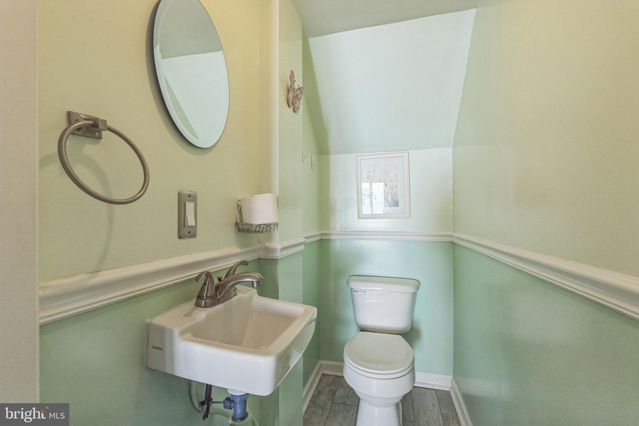 3566 Edgemont Street Philadelphia, PA 19134 - Photo 15 of 25 a bathroom with a sink toilet and a mirror