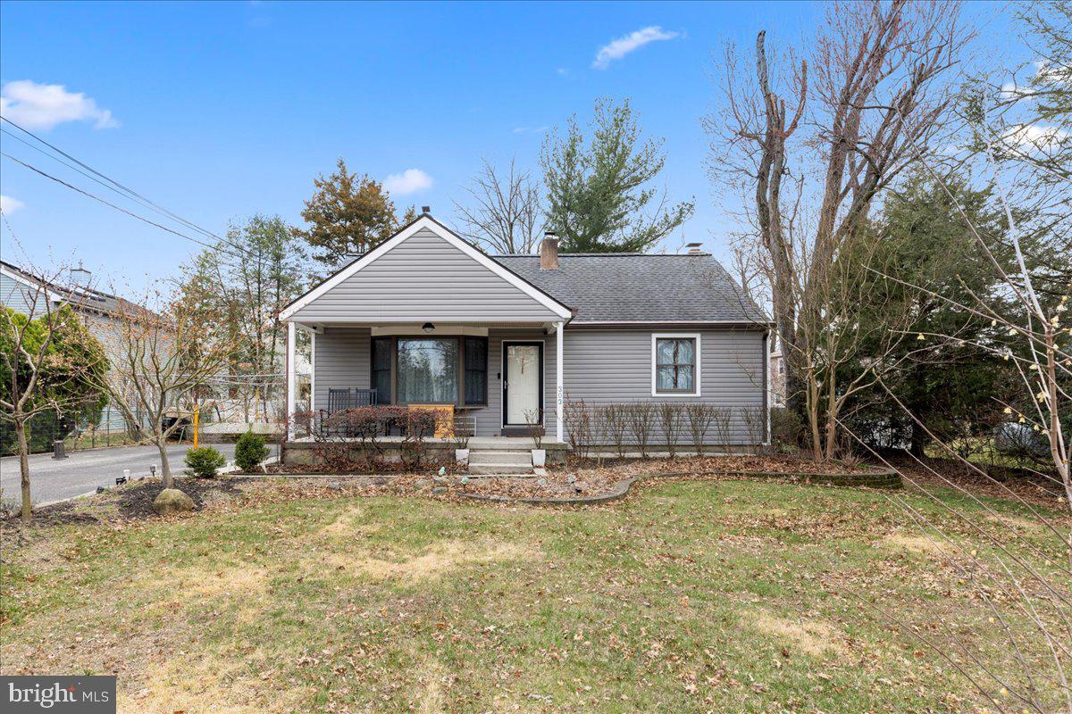 303 East Evesham Road Voorhees, NJ 08043 - Photo 1 of 34 a front view of a house with garden