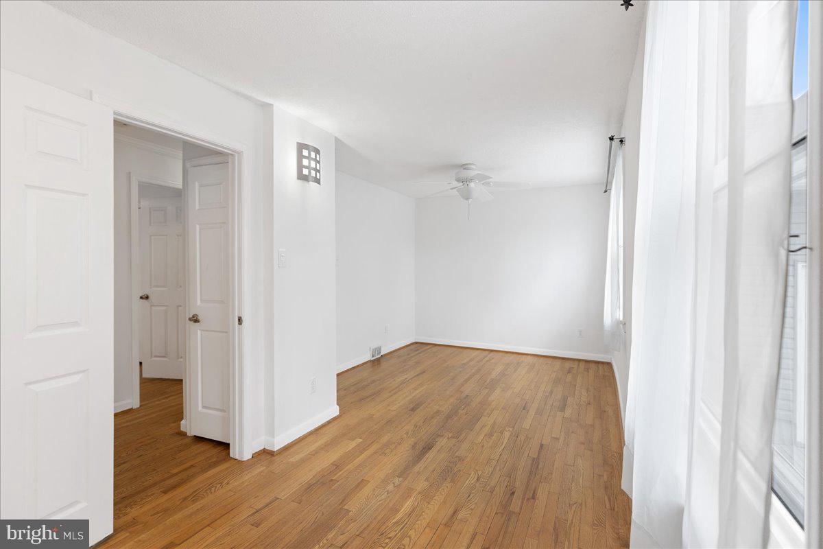 303 East Evesham Road Voorhees, NJ 08043 - Photo 20 of 34 a view of an empty room with wooden floor
