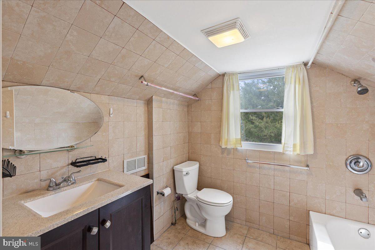 303 East Evesham Road Voorhees, NJ 08043 - Photo 27 of 34 a bathroom with a toilet sink vanity and mirror