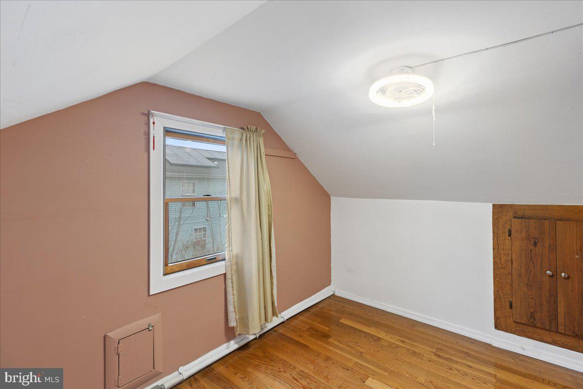 303 East Evesham Road Voorhees, NJ 08043 - Photo 29 of 34 a view of an empty room with wooden floor and a window