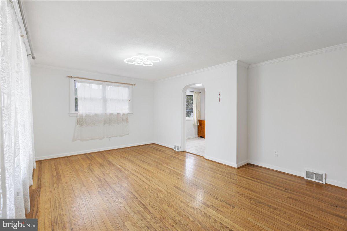 303 East Evesham Road Voorhees, NJ 08043 - Photo 5 of 34 an empty room with wooden floor and windows