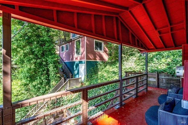 a view of balcony with furniture