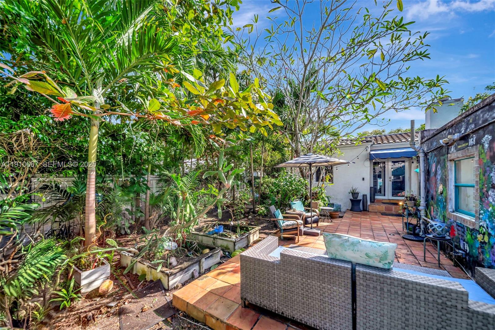619 Northeast 87th Street Miami, FL 33138 - Photo 29 of 38 a outdoor living space with patio furniture and a potted plant
