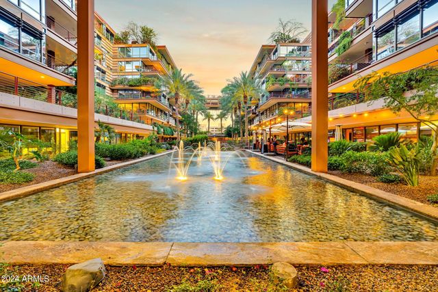a view of swimming pool with a outdoor seating