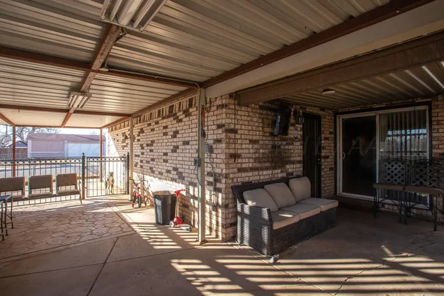 a outdoor space with patio lots of furniture and garden view