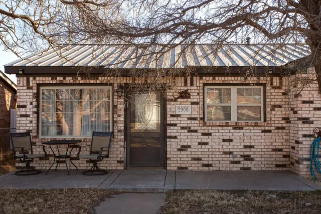 a front view of a building with large windows