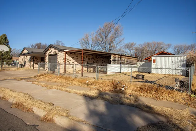 a view of a house with snow on the road