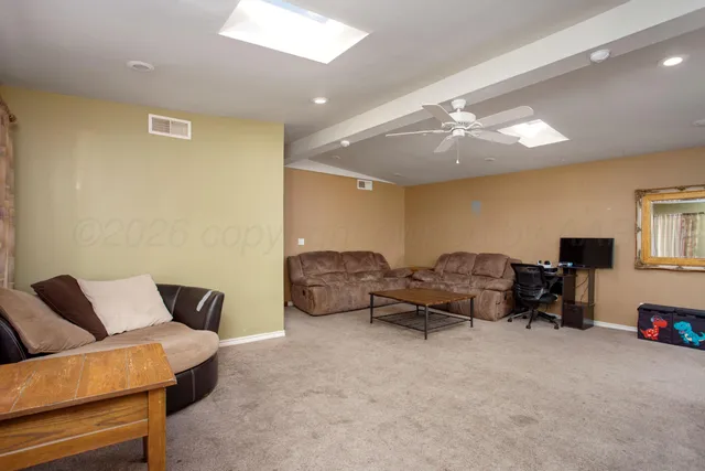a living room with furniture and a couch