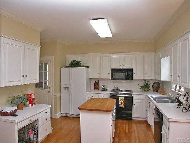 6400 Northwyck Place Raleigh, NC 27609 - Photo 7 of 12 Island Kitchen w/ Hardwoods