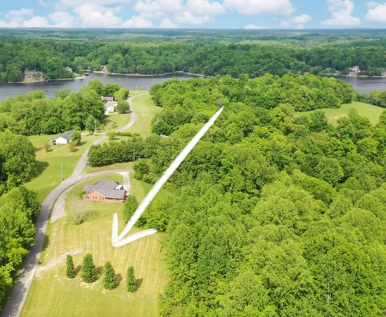 a view of a lake with a yard