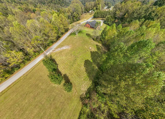 a view of a lake with a house in the background
